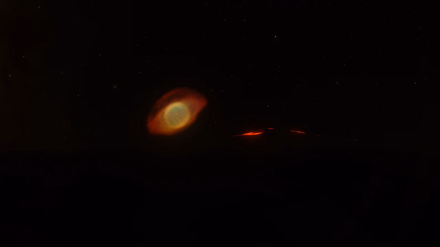 Active Volcanoes on Falanji with the Helix Nebula visible in the background.